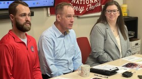 (Left to right) Cherry Festival Air Show Director Christen Smith, aviation attorney Steve Tupper and Cherry Festival Executive Director Kat Paye deliver statements to the press in the National Cherry Festival offices on Union Street.