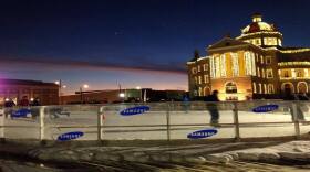 A scene from the 2013 Wonderland of Lights where ice skaters glide in front of the historic courthouse on the square in Marshall.