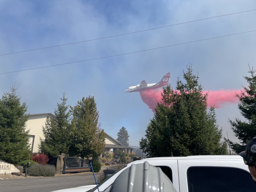 Aerial firefighting crews drop fire retardant on a fire outside of Spokane in 2022. Photo by Jay Wilkins.