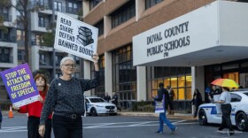Hope McMath protesting outside a Duval County School Board meeting.