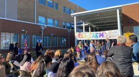  People watching a stage with children
