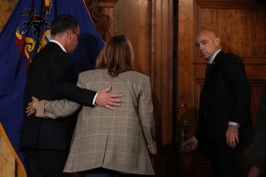 Pennsylvania Gov. Josh Shapiro, left, and wife Lori Shapiro leave a news conference Tuesday, Oct. 14, 2025 in Harrisburg.