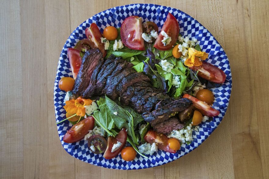 Chef Kathy Gunst's grilled steak salad with blue cheese, tomatoes, 
and greens. (Jesse Costa/WBUR)