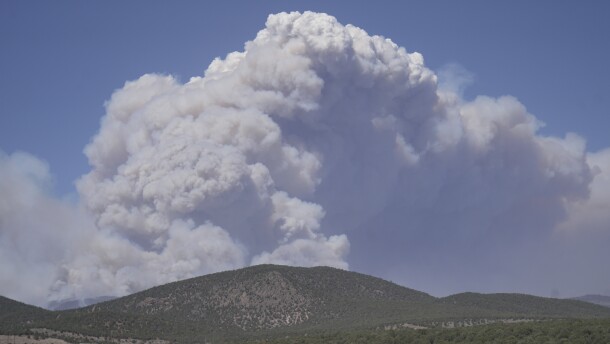 A plume of smoke rises from the Cottonwood Fire, Friday, June 26, 2026, near Beaver, Utah.