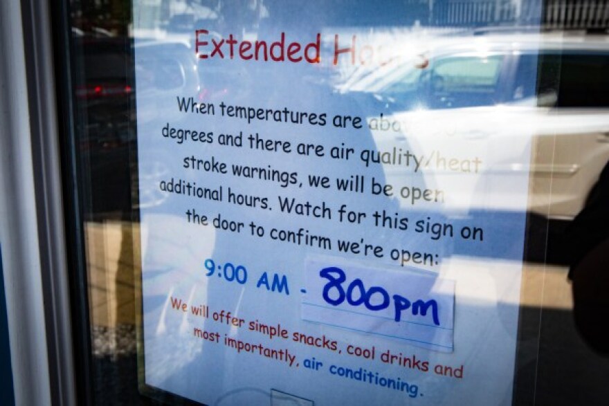 A sign on the door at the Seeds of Hope Center in Biddeford on Thursday, Aug. 12, 2021 announces extended hours on days with heat advisories.