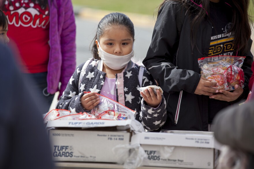 Grab-and-go breakfasts and lunches were handed out to children 2 to 18 years old at a middle school in Arlington, Va.