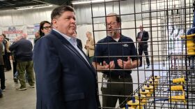 Plant Manager Mike Havens shows some of the company’s products to Gov. JB Pritzker.