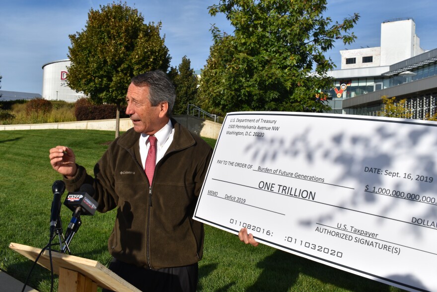 GOP presidential candidate Mark Sanford speaks outside the Caterpillar Visitor's Center in Peoria on Friday. 