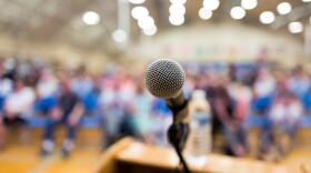 Close up of microphone on a podium in an auditorium