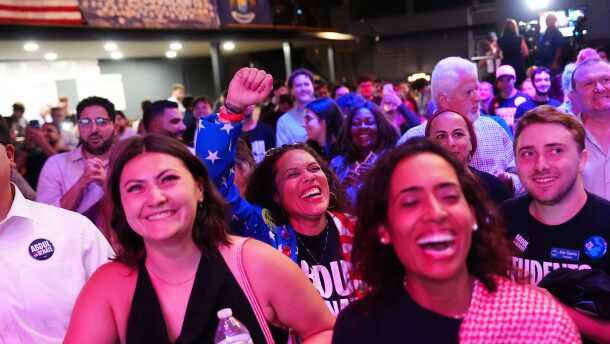 Attendees listen as Abdul El-Sayed speaks during a primary election night event. 