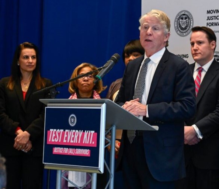 Manhattan District Attorney Cy Vance Jr. appears at a podium with the sign "TEST EVERY KIT."
