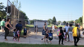 Parents drop off students at MPS's MacDowell Montessori on the first day of school.