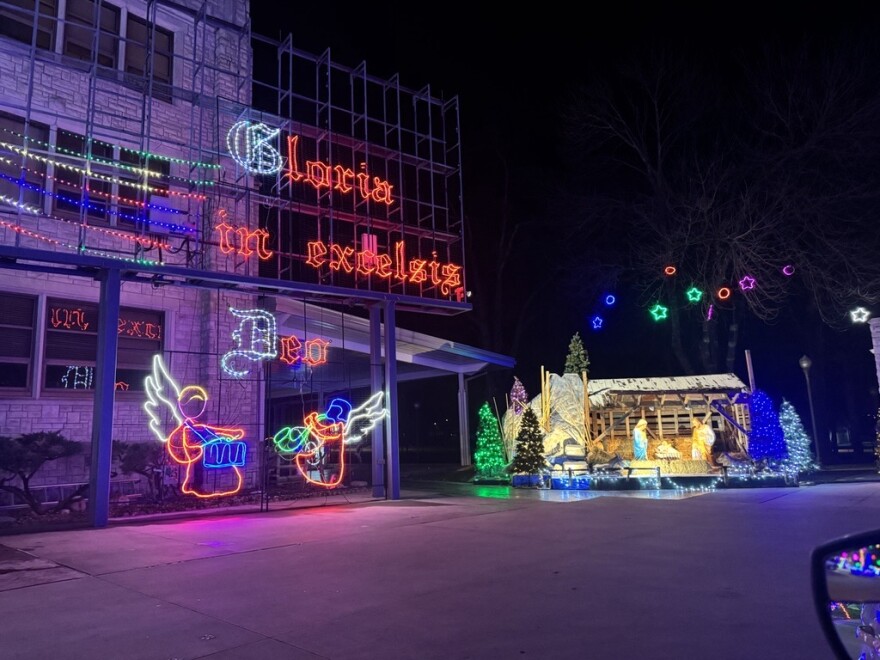 This years manger scene features a large lighted display with the words "Gloria in excelsis" - which is a latin phrase meaning Gloria to God in the Highest