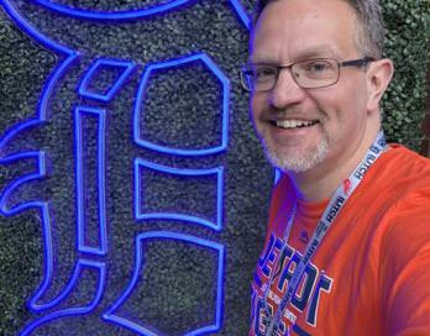 Ryan Wooley stands with the Detroit Tigers' Olde English D.