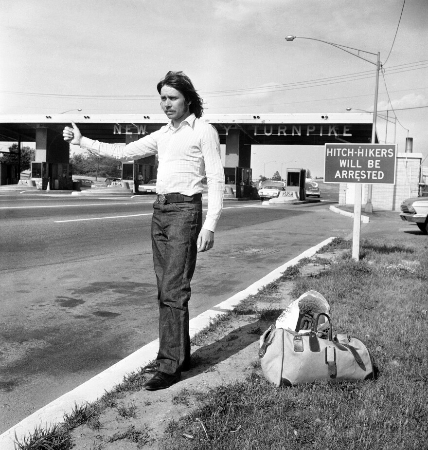 Roland Klein, on vacation to the U.S. from Germany, holds out his arm in the familiar request for a hitch at the entrance to the New Jersey Turnpike near New Brunswick, June 24, 1971.