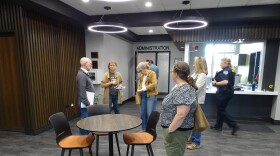 Town of Beloit administrator John Malizio (far left) talks with concerned citizens including Brittany Keyes (next to Malizio) after June 1 town board meeting.