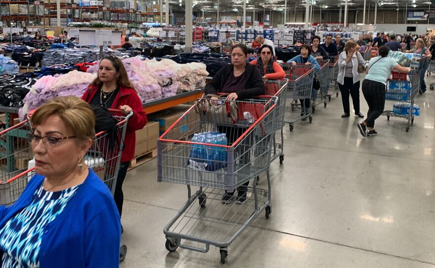 Customers line up to buy water and other supplies in Burbank, Calif., on March 6 in reaction to fears that the novel coronavirus would spread and force people to stay indoors.