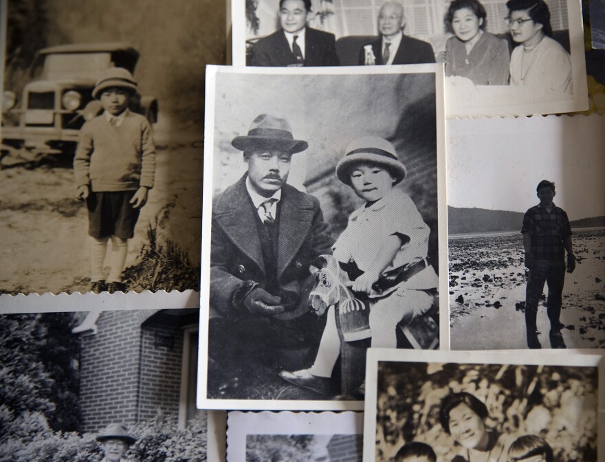 Family photos, including one of 2-year-old Jerry Yamashita with his father, Masahide Yamashita, are shown on Friday, Feb. 9, 2018, in Seattle. 