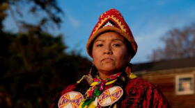 Indigenous woman holding missing woman poster