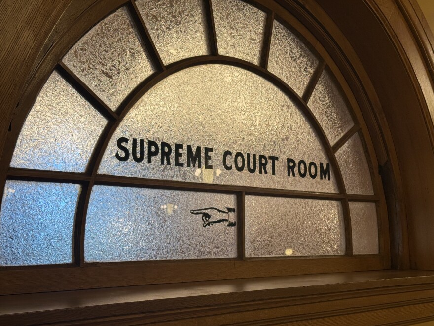 A sign directing visitors at the Kansas State Capitol to the old Kansas Supreme Court which housed the state's highest court until 1978.