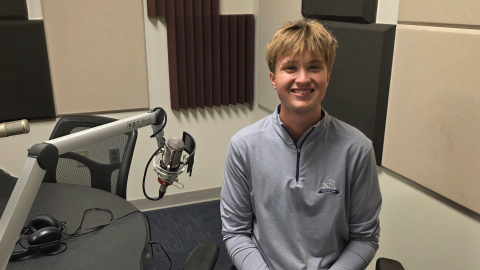 Gavin Kornack at the mic in NPR Illinois Studio F.