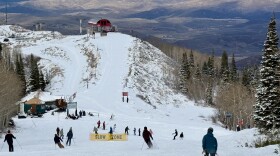 Skiers and riders travel down upper Homerun from Bonanza Express after it opened Dec. 20, 2025.