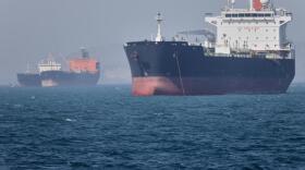 Oil tankers sit at anchor offshore in the Strait of Hormuz off Bandar Abbas, Iran, Saturday, May 2, 2026. (Amirhosein Khorgooi/ISNA via AP)