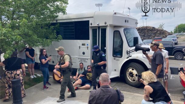 Some protesters outside the U.S. Immigration and Customs Office on Cataldo Avenue in Spokane interacted with masked and unmasked law enforcement officers on June 11.