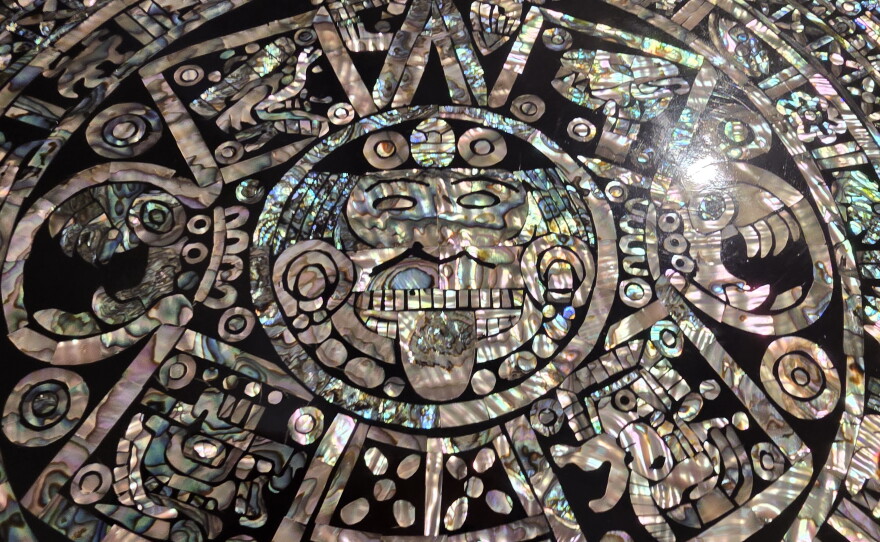 A Mayan calendar with abalone inlay in black resin reflects the pre-Columbian heritage of Mexico. This, and other Mayan calendars, are on display at CityArts Orlando.