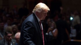 Republican presidential candidate Donald Trump walks on stage after signing autographs during a campaign stop at The Fox Theatre on June 15, 2016 in Atlanta, Georgia. (Branden Camp/Getty Images)