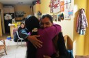 Mirsy Maricela Alva Lopez, right, embraces a relative as she and her children return to the home they all shared in West Palm Beach, nearly one year after being separated by the U.S. government for the second time, Thursday, May 28, 2026.