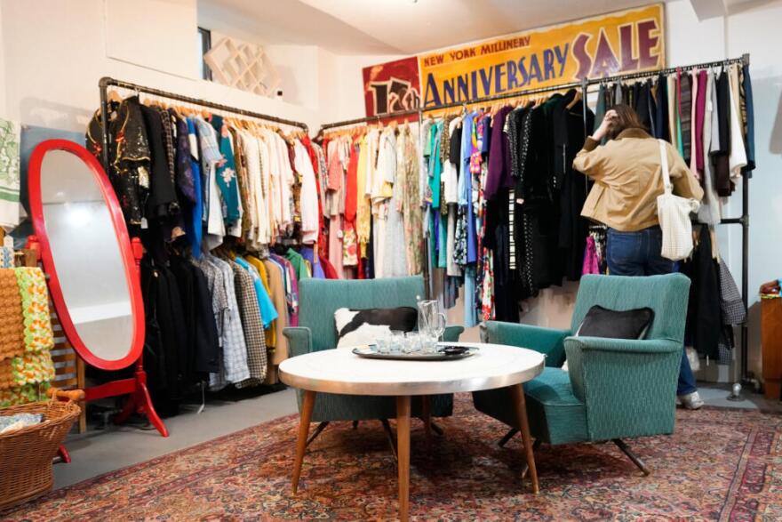 A shopper looks at a rack at Mothership, a vintage and thrift store, Thursday, March 26, 2026, in New York. (Alyssa Goodman/AP)