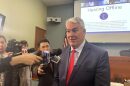 Then-Indiana Utility Regulatory Commission Chair Andy Zay answers reporter questions during a break in a daylong utility affordability hearing on March 24, 2026, at the IURC’s downtown Indianapolis headquarters.