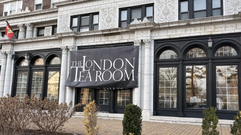 A London Tea Room banner hangs on a building off Union Boulevard in DeBaliviere Place.