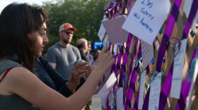 At a silent vigil held by Seattle Center, people left notes in honor of the victims of Sunday's shooting at Bite of Seattle.