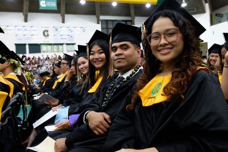Graduates pose for a photo at the University of Guam Fañomnåkan (Spring) 2025 Commencement Ceremony at the UOG Calvo Field House in May.