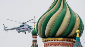 One of the helicopters of Russian President Vladimir Putin flies near St. Basil's Cathedral in Moscow on March 26, 2018, while preparing to land at The Kremlin. (Mladen Antonov/AFP/Getty Images)