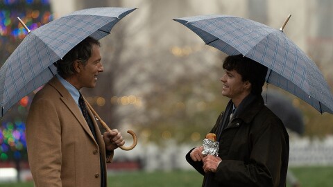 Actors John Corbett as Denny O'Leary (left) and Joel Courtney as John O'Leary (right) stand in front of the Old Courthouse in the new film 'Soul on Fire'.