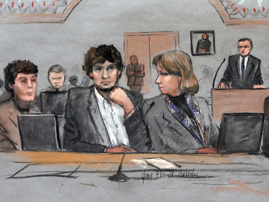 In this courtroom sketch, Dzhokhar Tsarnaev (center) is depicted between defense attorneys Miriam Conrad (left) and Judy Clarke during his federal death penalty trial on March 5.