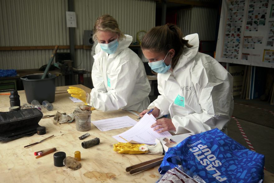 Volunteers tally the type of plastic captured.
