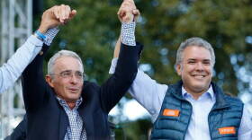 PLIABLE PROTEGE? Colombian President-elect Ivan Duque (right) on the campaign trail with former President Alvaro Uribe in May.