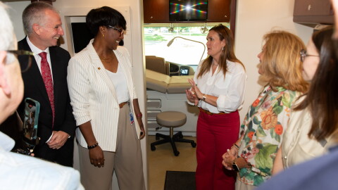 Dr. Shane Speights and Dr. Brookshield Laurent of NYIT College of Osteopathic Medicine at Arkansas State University provide Arkansas Governor Sarah Huckabee Sanders and Secretary of Health Renee Mallory with a tour of the medical school's "Delta Care-a-Van" mobile health unit during Sanders' Aug. 11 visit to the Jonesboro campus. On Thursday, Sanders awarded NYITCOM at A-State with a $1.5 million grant to be used for a maternal health initiative, and the med school will devote a portion of the grant funds to purchase a second mobile health unit to be used for maternal health care.