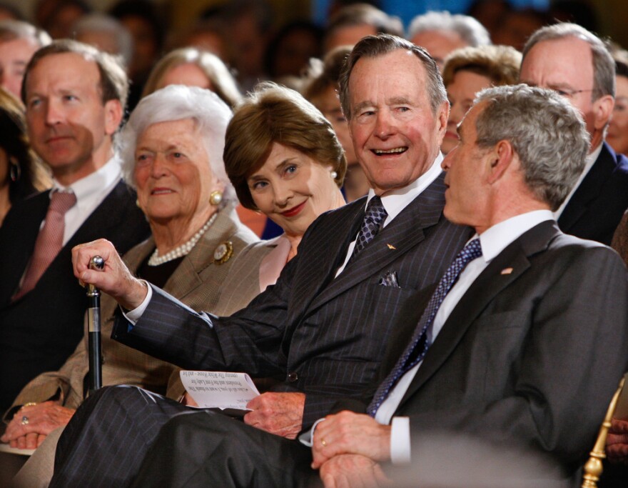 Bush with (from left) his son Neal Bush; wife, Barbara Bush; daughter-in-law Laura Bush; and son former President George W. Bush at a reception in honor of the Points of Light Institute at the White House on Jan. 7, 2009.