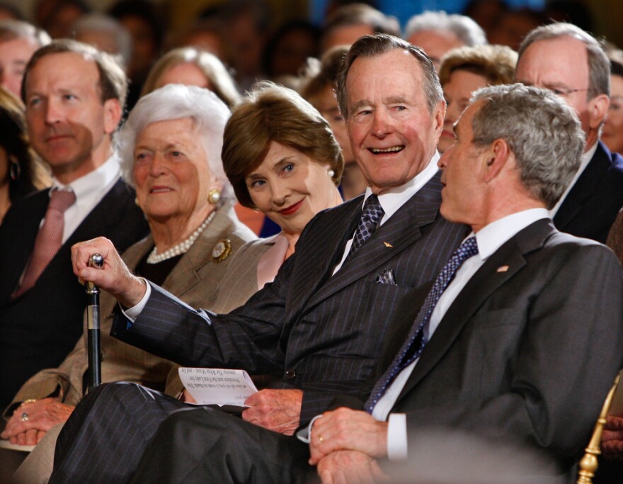 Bush with (from left) his son Neal Bush; wife, Barbara Bush; daughter-in-law Laura Bush; and son former President George W. Bush at a reception in honor of the Points of Light Institute at the White House on  Jan. 7, 2009.