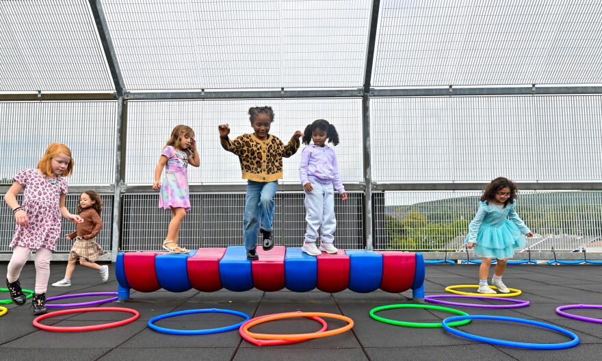 Kindergarten students in the St. Clair Area School District play on the rooftop playground during recess.