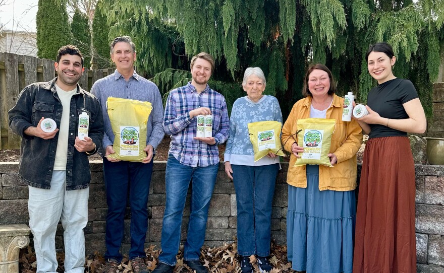 Soil Food owners and their family pose with the product line.