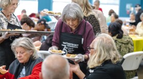 Volunteers serve Thanksgiving meals at Waterfront Rescue Mission. 