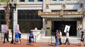  Protesters from Take ‘Em Down Jax hold their regular Friday picket line in front of Jacksonville’s City Hall, demanding lawmakers take action to remove Confederate monuments.