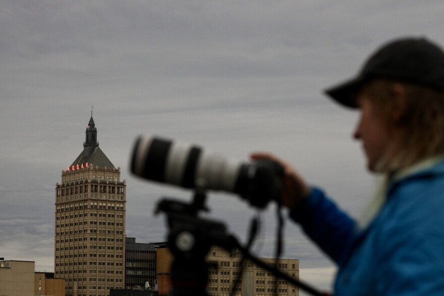 An eclipse photographer works to capture the event on Monday.