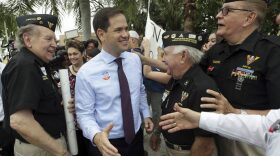 FILE- In this Oct. 31, 2016 file photo, Sen. Marco Rubio, R-Fla. greets supporters after early voting at the West Miami Community Center in West Miami, Fla. Florida voters decide Tuesday, Nov. 8, 2016, whether Marco Rubio should serve a second term, medical marijuana should be legalized and to pick at least eight new U.S. House members. (AP Photo/Lynne Sladky, File)